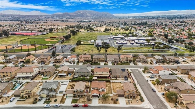 birds eye view of property with a residential view and a mountain view