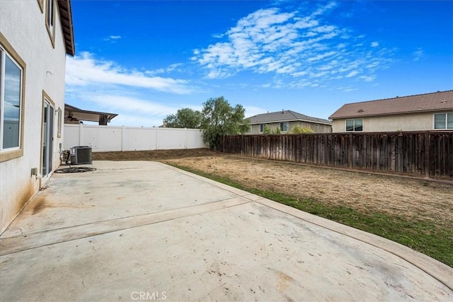 view of patio / terrace featuring central AC unit and a fenced backyard