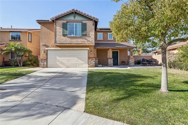 view of front of home featuring a garage and a front yard