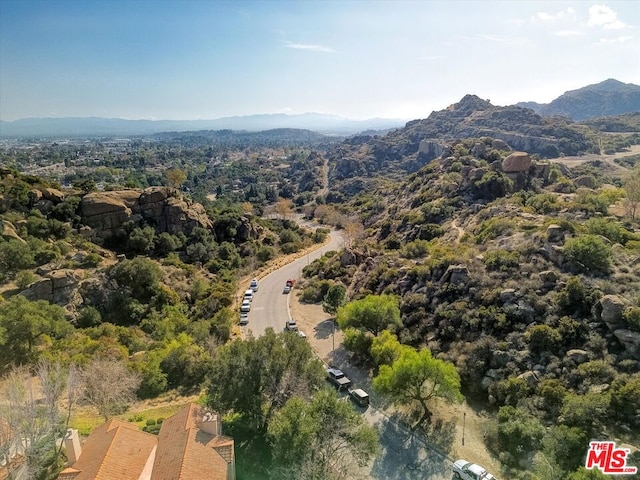 birds eye view of property featuring a mountain view