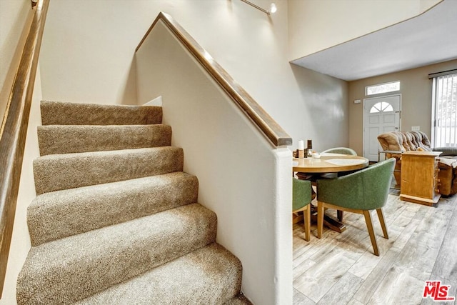 stairs with wood-type flooring