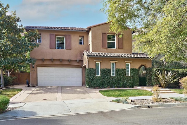 mediterranean / spanish house featuring a garage