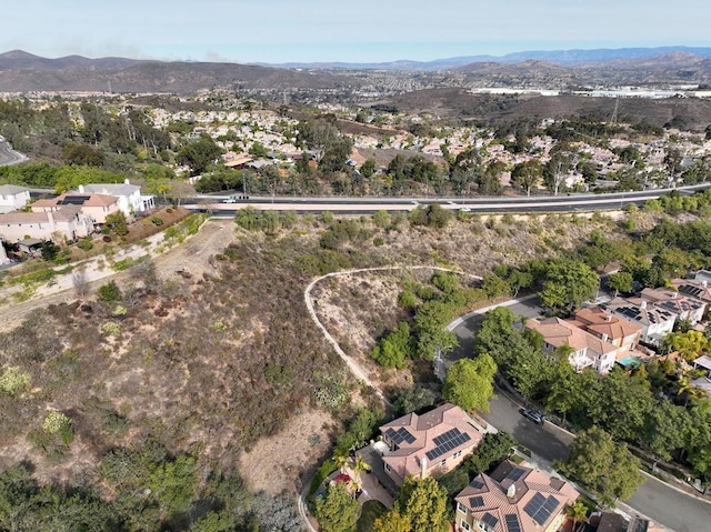 birds eye view of property with a mountain view