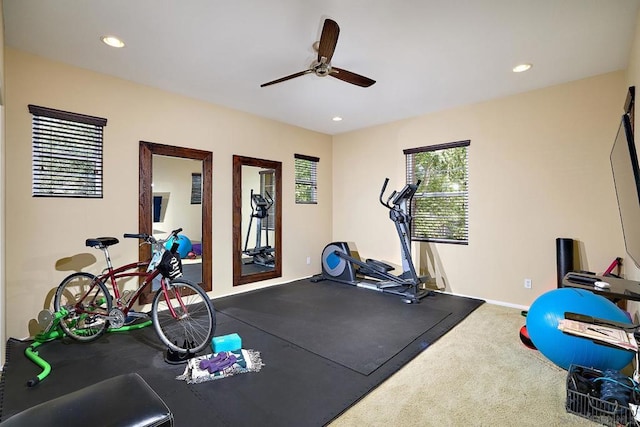 exercise room with carpet floors and ceiling fan