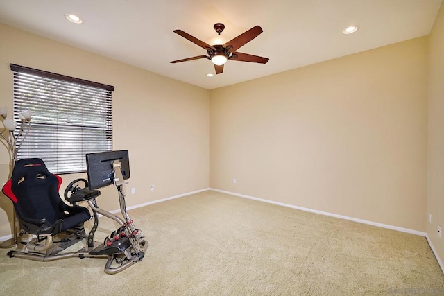 exercise room with carpet flooring and ceiling fan