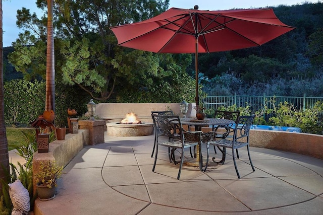 view of patio featuring a fire pit