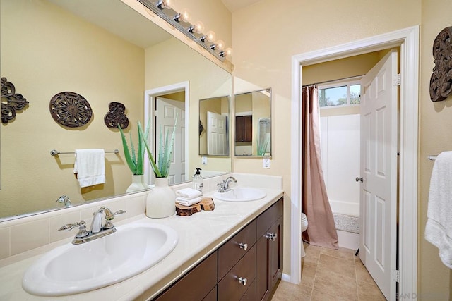 full bathroom with vanity, toilet, tile patterned flooring, and shower / tub combo