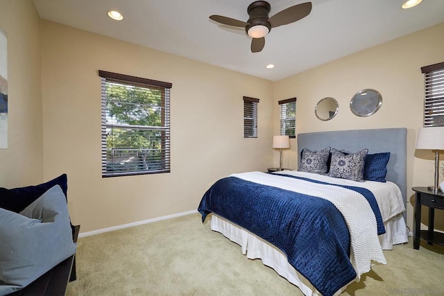 bedroom with light carpet and ceiling fan