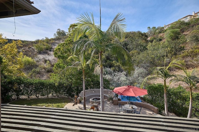 view of patio / terrace featuring an outdoor fire pit