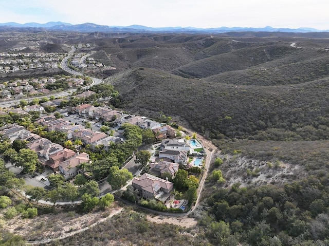 birds eye view of property featuring a mountain view