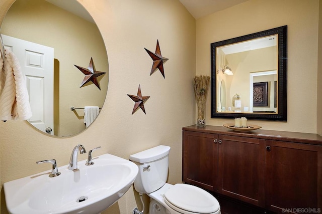 bathroom featuring sink and toilet