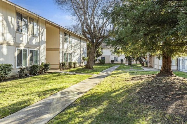 view of community featuring a yard