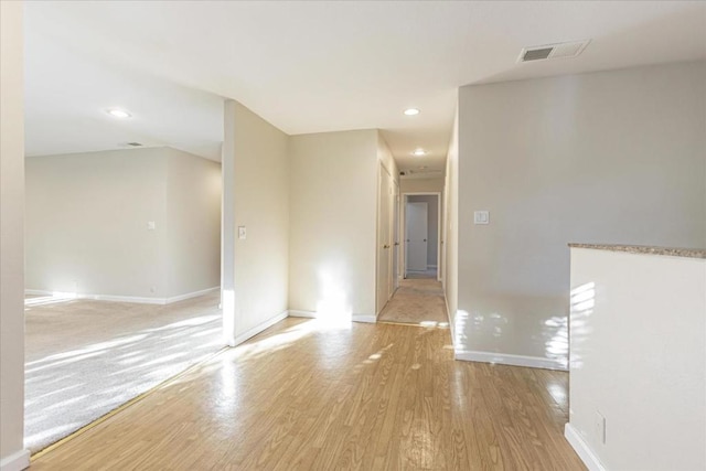 empty room with light hardwood / wood-style floors