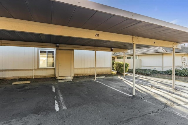 view of vehicle parking with a carport