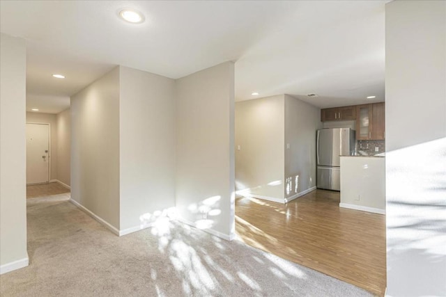 spare room featuring light hardwood / wood-style flooring