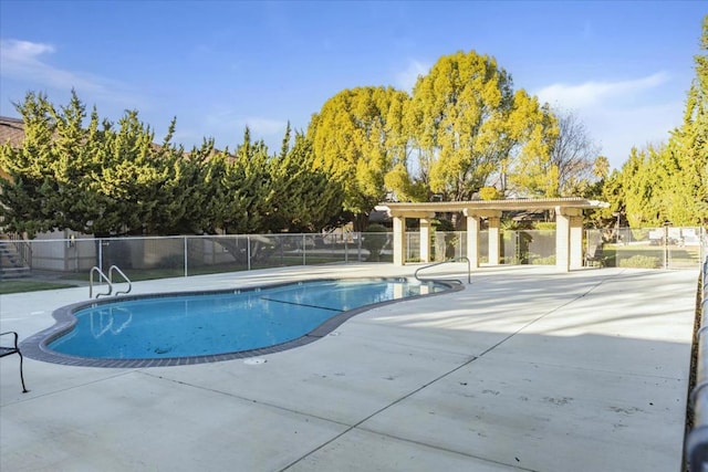 view of swimming pool with a patio