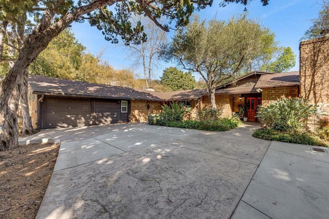 ranch-style home featuring a garage