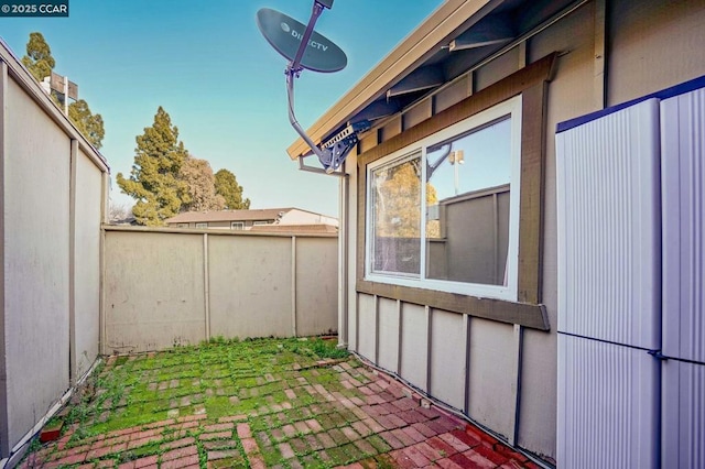 view of side of home featuring a patio