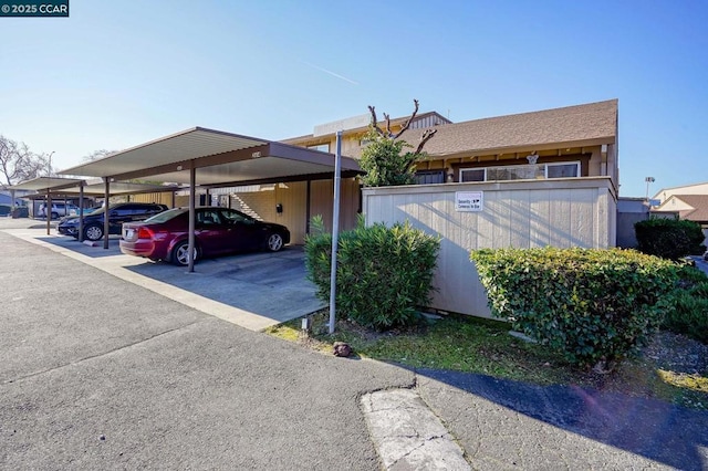 view of parking / parking lot with a carport