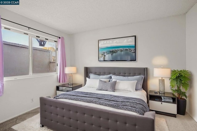 carpeted bedroom with a textured ceiling