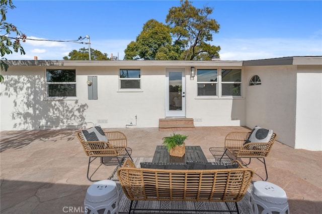 rear view of property with a patio area