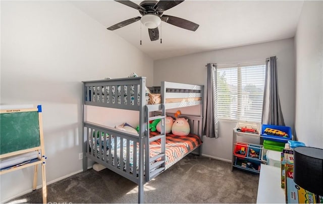 bedroom with vaulted ceiling, ceiling fan, and dark carpet