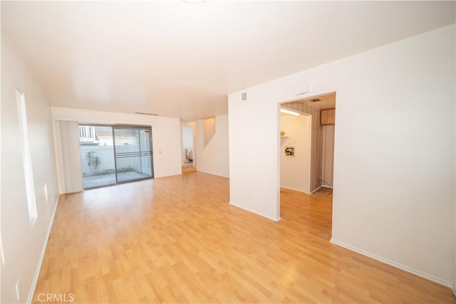 unfurnished room featuring light wood-type flooring