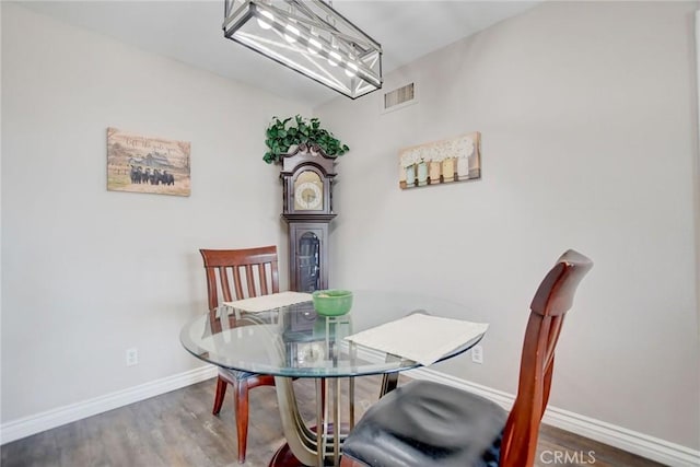 dining area with hardwood / wood-style floors