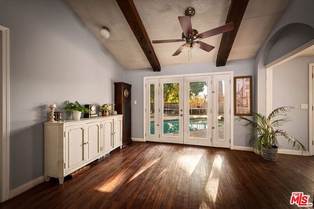 interior space featuring dark wood-type flooring, ceiling fan, vaulted ceiling with beams, a textured ceiling, and french doors