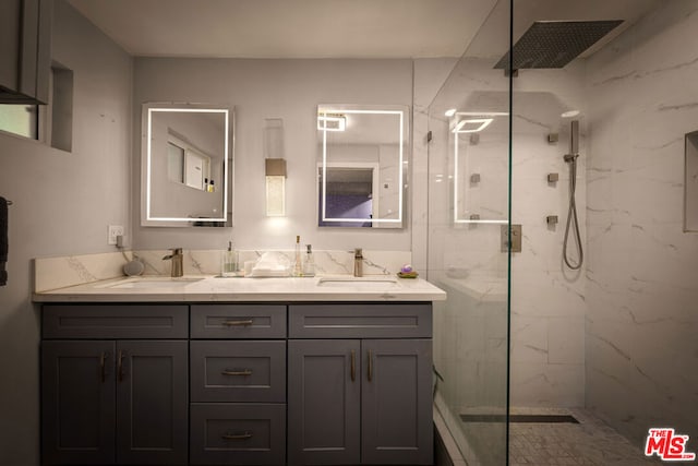 bathroom featuring vanity and a tile shower