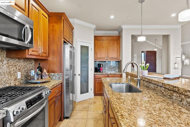 kitchen with sink, stainless steel appliances, ornamental molding, light stone countertops, and decorative backsplash