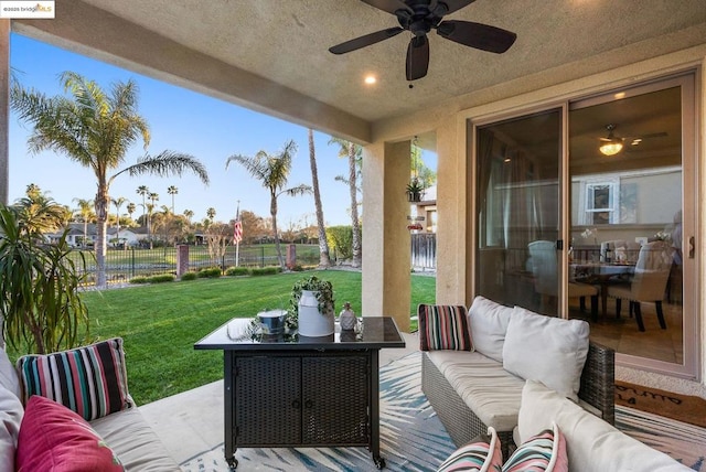 view of patio featuring an outdoor living space and ceiling fan