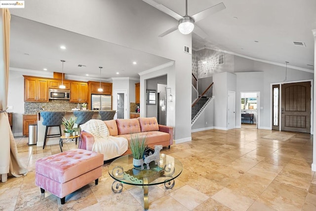 living room featuring crown molding, lofted ceiling, and ceiling fan