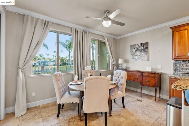 dining space featuring crown molding and ceiling fan