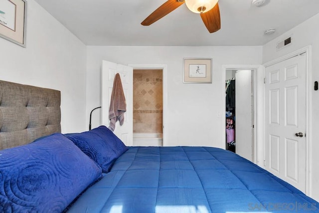 bedroom featuring ceiling fan and ensuite bath