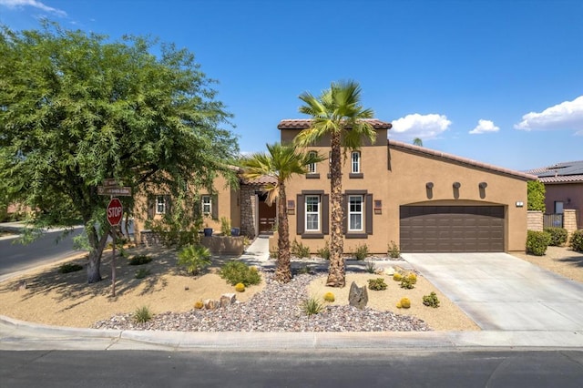 mediterranean / spanish-style home featuring a garage