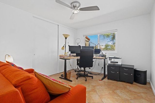 tiled office space featuring ceiling fan