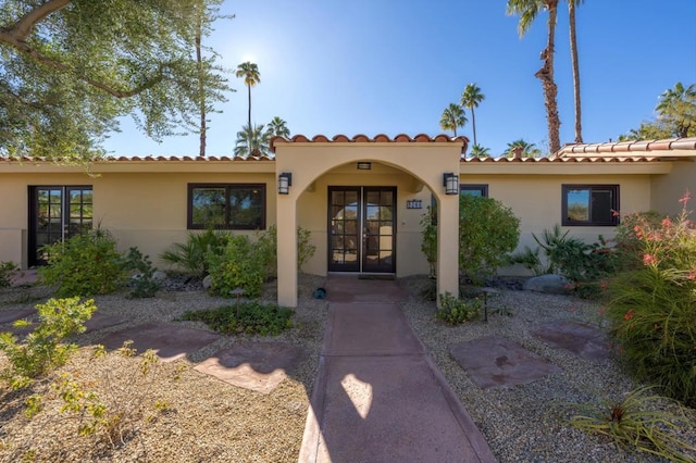 property entrance featuring french doors