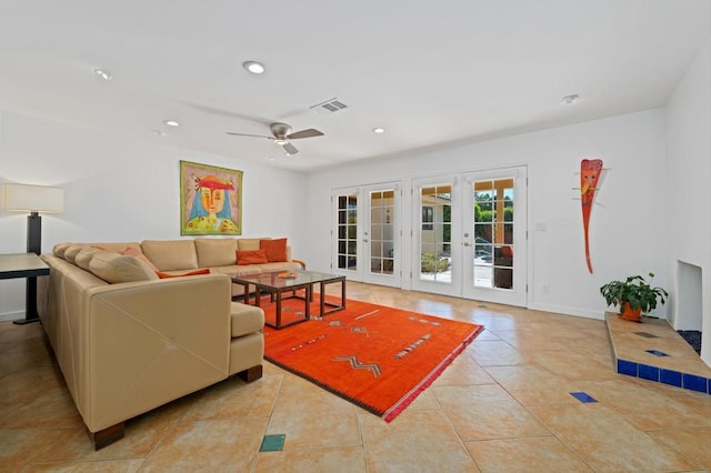 tiled living room featuring french doors and ceiling fan