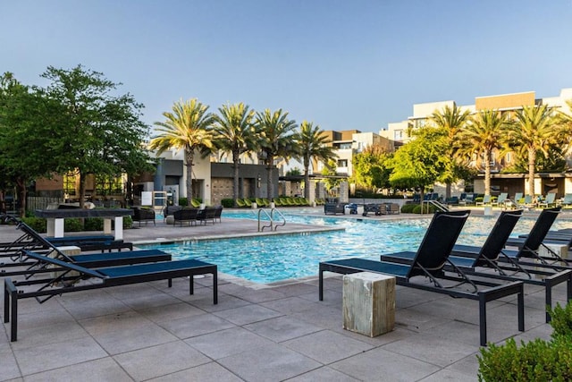 view of swimming pool with a patio