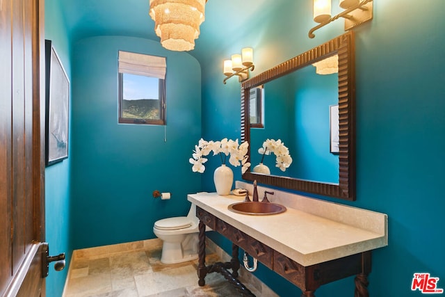 bathroom featuring toilet and sink