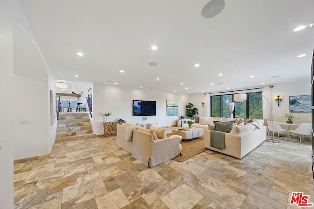 living room featuring floor to ceiling windows