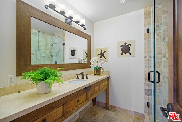 bathroom with vanity and an enclosed shower