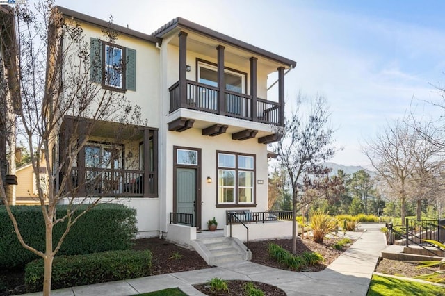 view of front of property with a balcony