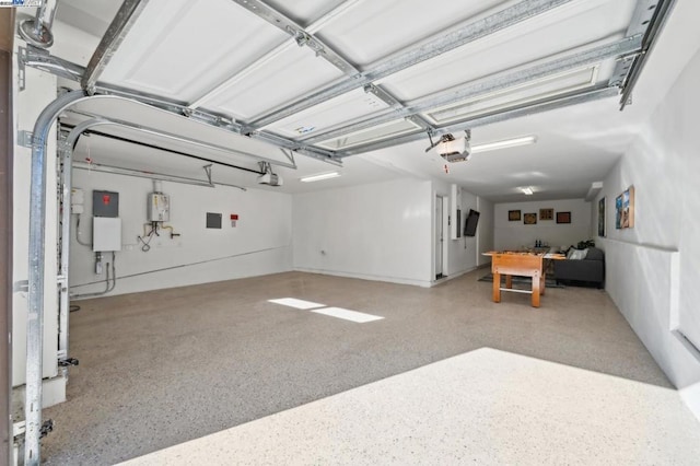 garage with a garage door opener and water heater