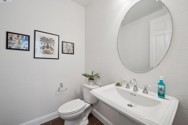 bathroom with toilet and sink