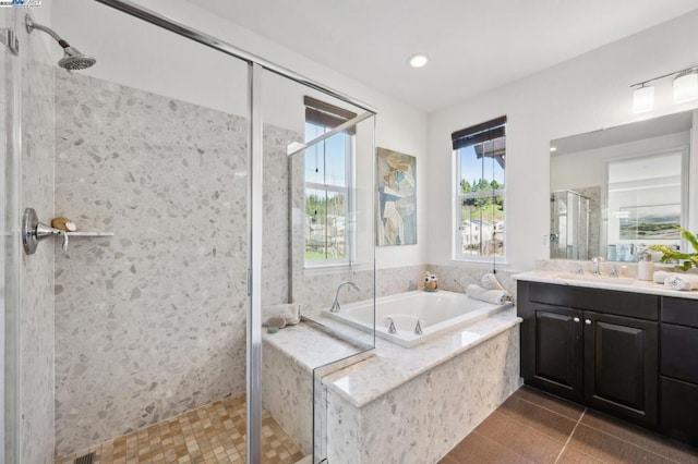 bathroom with vanity, tile patterned flooring, and independent shower and bath