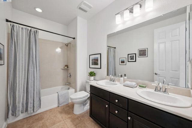 full bathroom featuring vanity, tile patterned floors, shower / bath combination with curtain, and toilet