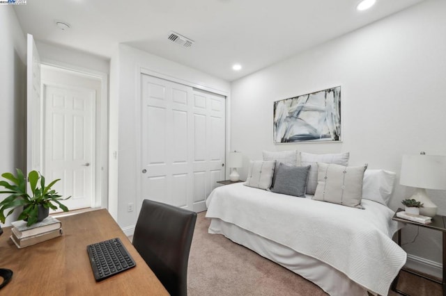 carpeted bedroom featuring a closet