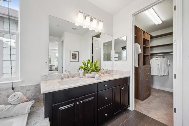 bathroom featuring vanity and tile patterned flooring